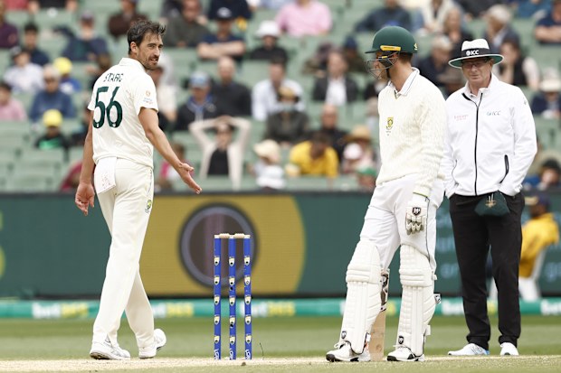 Mitchell Starc of Australia speaks to Theunis de Bruyn of South Africa about staying in his crease. (Photo by Darrian Traynor - CA/Cricket Australia via Getty Images)