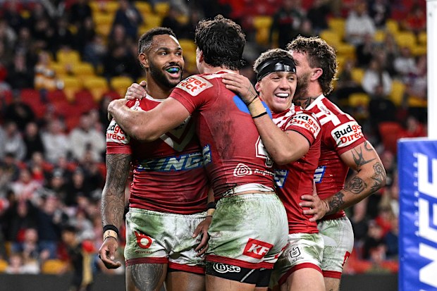 BRISBANE, AUSTRALIA - JUNE 28: Hamiso Tabuai-Fidow of the Dolphins celebrates with team mates after scoring a try during the round 17 NRL match between South Sydney Rabbitohs and Dolphins at Suncorp Stadium, on June 28, 2025, in Brisbane, Australia. (Photo by Bradley Kanaris/Getty Images)