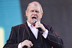 John Farnham, pictured performing in 2020, has confirmed he will never sing in public again.