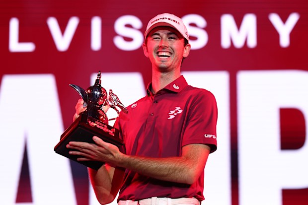 Elvis Smylie of Ripper GC poses for a photo with the trophy after winning the final round.