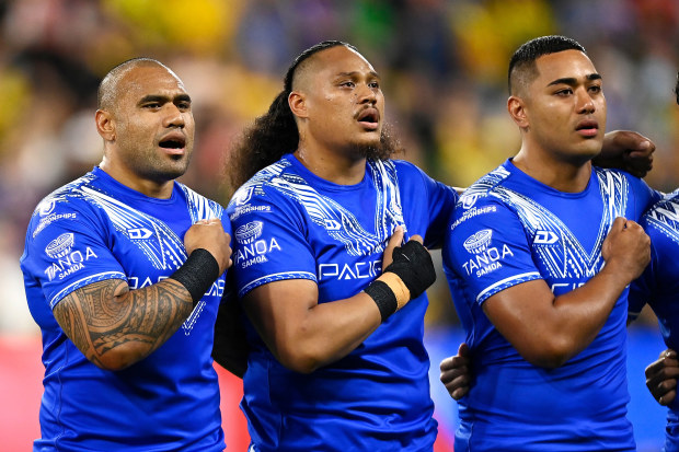 Samoan players sing their national anthem.