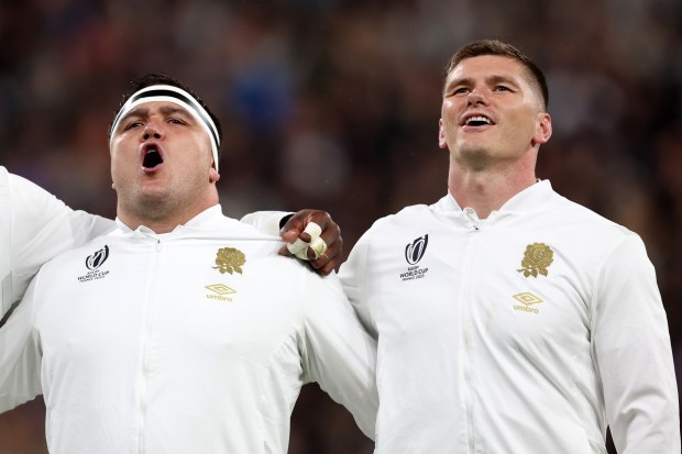 Jamie George (left) and Owen Farrell sing the national anthem.
