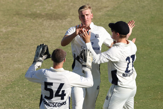 Will Sutherland of Victoria celebrates taking a wicket.