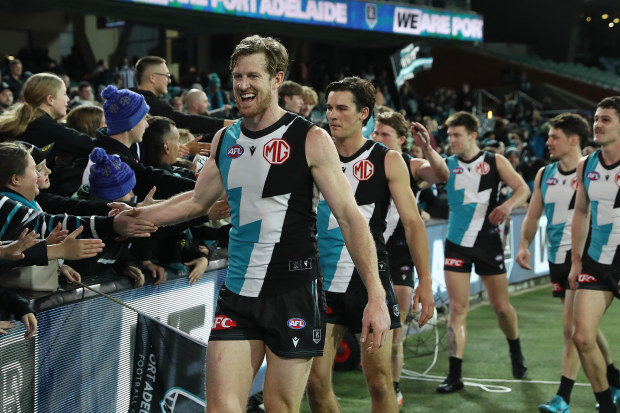 ADELAIDE, AUSTRALIA - AUGUST 13: Tom Jonas of the Power with fans after the win during the 2023 AFL Round 22 match between the Port Adelaide Power and the GWS GIANTS at Adelaide Oval on August 13, 2023 in Adelaide, Australia. (Photo by Sarah Reed/AFL Photos via Getty Images)