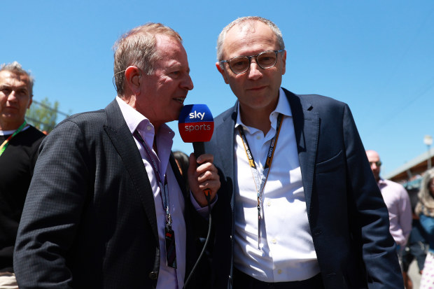 Martin Brundle (left) speaks with Formula 1 boss Stefano Domenicali.