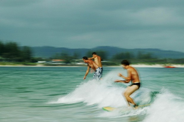 Surfers at The Pass, a beach at Byron Bay on the NSW North Coast. 
