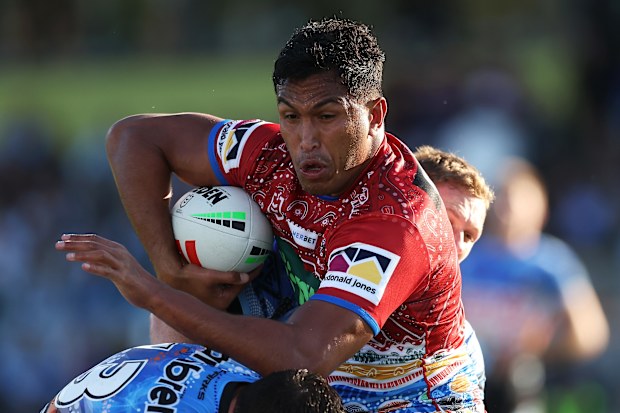 COFFS HARBOUR, AUSTRALIA - MAY 20: Jacob Saifiti of the Knights is tackled during the round 12 NRL match between Cronulla Sharks and Newcastle Knights at Coffs Harbour International Stadium on May 20, 2023 in Coffs Harbour, Australia. (Photo by Mark Kolbe/Getty Images)