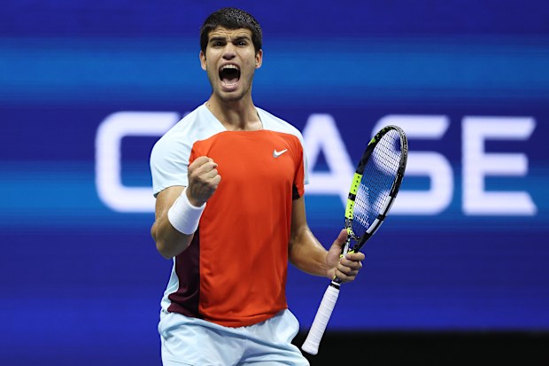 Carlos Alcaraz of Spain celebrates winning the second set against Frances Tiafoe of the United States.
