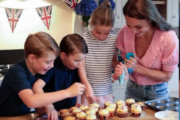 Prince George, Prince Louis and Princess Charlotte help Kate decorate the cupcakes