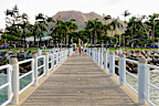 Townsville Australia October 30 2011: People enjoying a Spring day on The Strand in tropical North Queensland with iconic Castle Hill in the background.