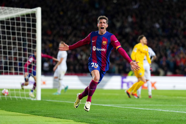 Sergi Roberto of FC Barcelona celebrates after Robert Lewandowski of FC Barcelona (not pictured) scores his team's third goal during the UEFA Champions League round of 16 second leg match.