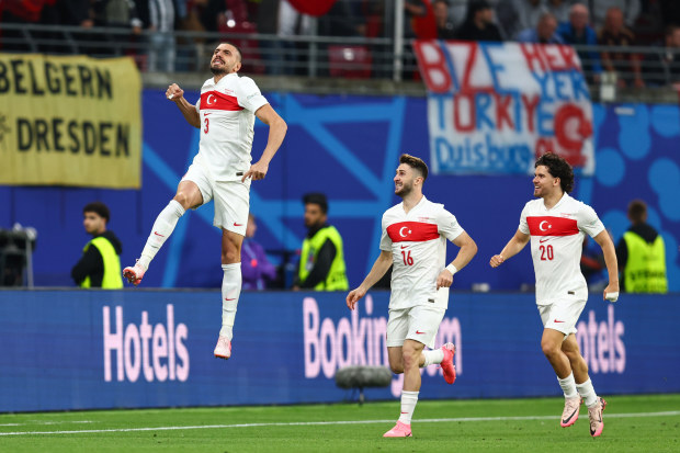 Merih Demiral of Turkey celebrates their first goal during the UEFA EURO round of 16 match between Austria and Turkey at Football Stadium Leipzig.