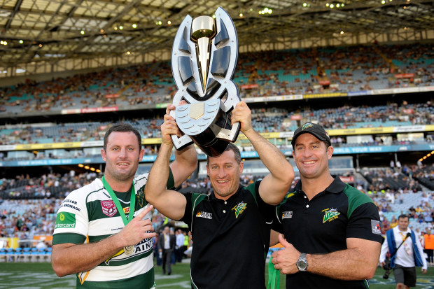 Chris Walker, Ben Walker and Shane Walker of the Ipswich Jets hold aloft the winners trophy after the 2015 State Championship Grand Final.