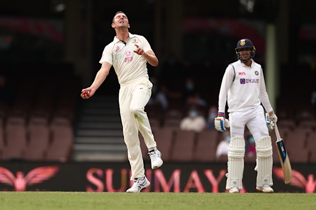 Josh Hazlewood of Australia takes a catch to dismiss Rohit Sharma of India off his own bowling.