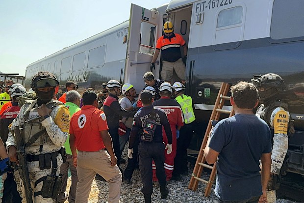Mexican Army soldiers and Civil Protection members rescue passengers from the Interoceanic train that derailed in the Asuncion Ixtaltepec area on the route to Oaxaca, Mexico, on December 28, 2025.
