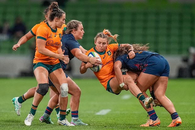 Georgina Friedrichs of the Wallaroos is tackled.