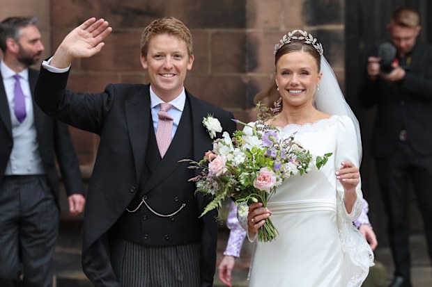 Hugh Grosvenor, Duke of Westminster and Olivia Grosvenor, Duchess of Westminster wave and smile to well-wishers after their wedding ceremony at Chester Cathedral on June 07, 2024 in Chester, England.