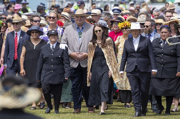 New Zealand Prime Minister Jacinda Ardern, centre, and her caucus arrive at Ratana, New Zealand, Tuesday, Jan. 24, 2023.