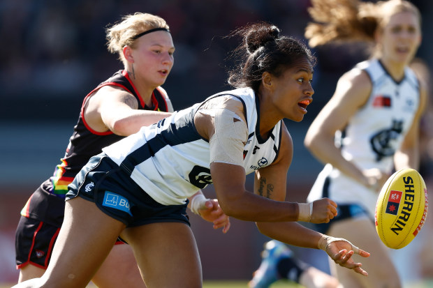 Vaomua Laloifi of the Blues is tackled by Paige Scott of the Bombers.