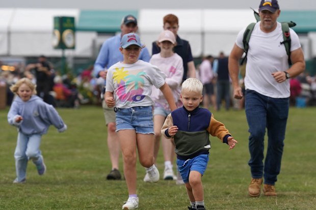 Mike Tindall with his children Mia (centre), Lena (left) and Lucas (front) at the Defender Burghley Horse Trials at Burghley House near Stamford