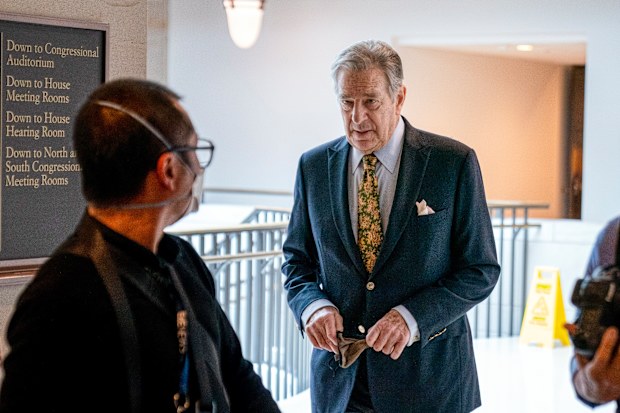 Paul Pelosi, right, the husband of House Speaker Nancy Pelosi, of California, follows his wife as she arrives for her weekly news conference on Capitol Hill in Washington, Thursday, March 17, 2022. 