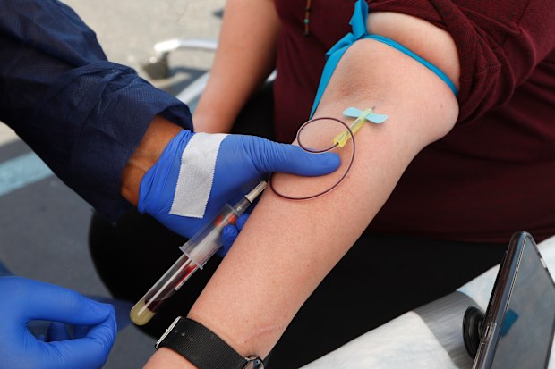 A woman has blood drawn for COVID-19 antibody testing in Dearborn, Michigan.