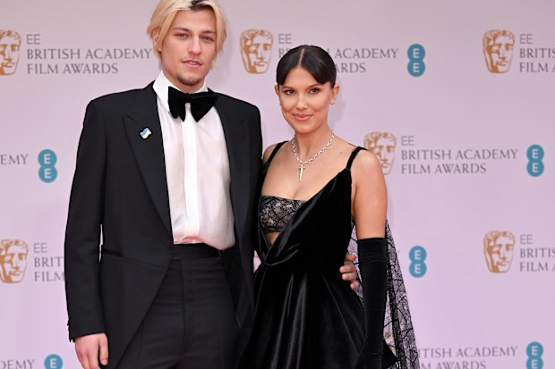Jake Bongiovi and Millie Bobby Brown attend the EE British Academy Film Awards 2022 at Royal Albert Hall on March 13, 2022 in London, England. 