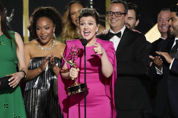 FILE - Kelly Clarkson, center, and the team from "The Kelly Clarkson Show" accept the award for outstanding daytime talk series during the 51st Daytime Emmy Awards on Friday, June 7, 2024, at the Westin Bonaventure in Los Angeles. (AP Photo/Chris Pizzello, File)