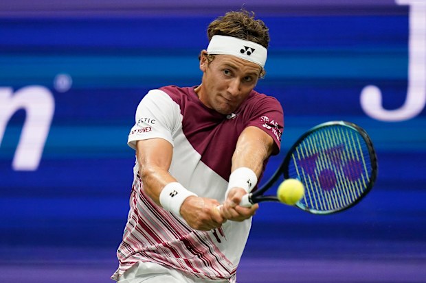 Casper Ruud, of Norway, returns a shot to Carlos Alcaraz, of Spain during the men's singles final of the U.S. Open tennis championships, Sunday, Sept. 11, 2022, in New York. (AP Photo/Charles Krupa)