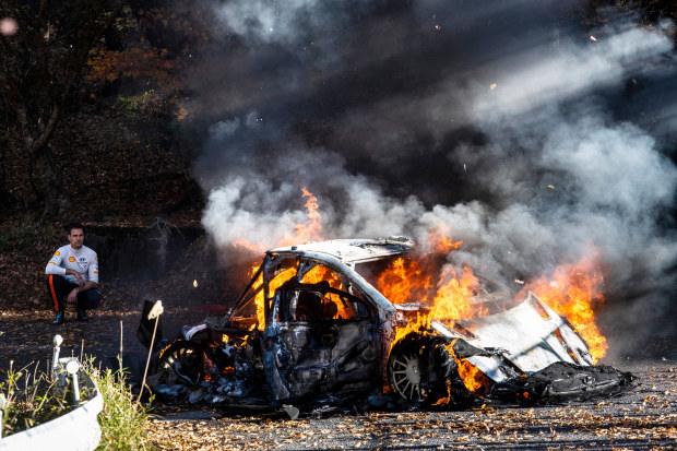 Dani Sordo looks on as his Hyundai i20 N burns to the ground.