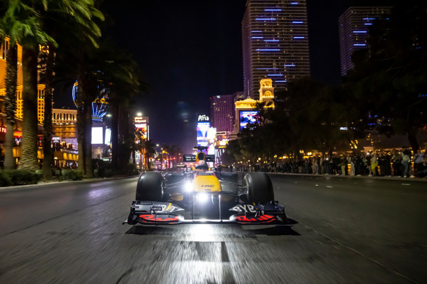 A Red Bull Racing F1 car drives down the Strip in Las Vegas.