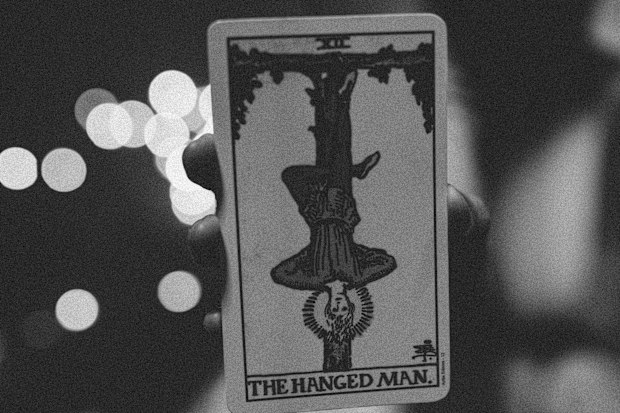 A stock photo of the hanged man tarot card.
