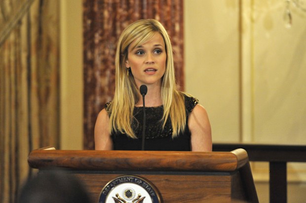Reese Witherspoon speaks at the Global Women's Leadership at the International Women of Courage Awards hosted by Secretary of State Hillary Clinton and attended by First Lady Michelle Obama in 2010.