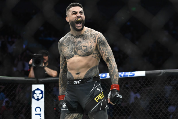Tyson Pedro of Australia celebrates after defeating Harry Hunsucker of the United States in a light heavyweight bout during UFC 278 at Vivint Arena.