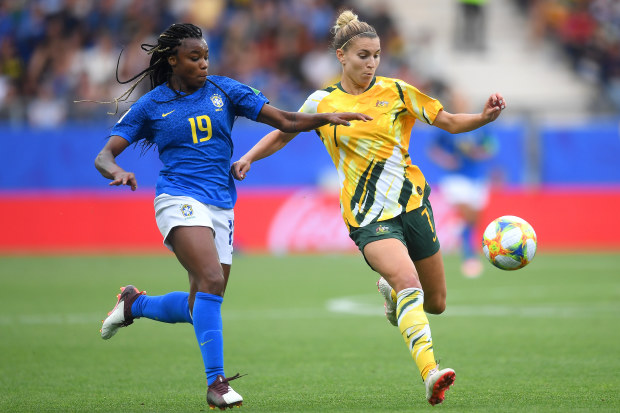 Brazil is challenged by Steph Catley of Australia. (Photo by Michael Regan/Getty Images)