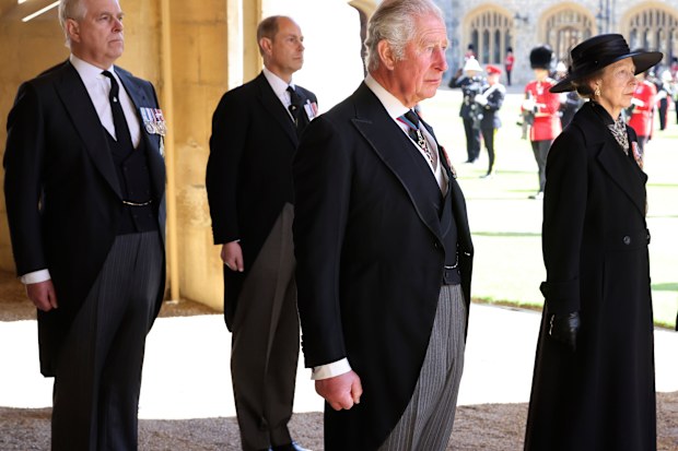 From left, Prince Andrew, Prince Edward, Prince Charles and Princess Anne arrive after walking in a procession behind the coffin of Prince Philip, with other members of the Royal family during the funeral of Britain's Prince Philip inside Windsor Castle in Windsor, England, Saturday, April 17, 2021. Prince Philip died April 9 at the age of 99 after 73 years of marriage to Britain's Queen Elizabeth II.