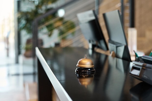 Contact the hotel before and tell them you're landing early and would like to ask to check-in early.