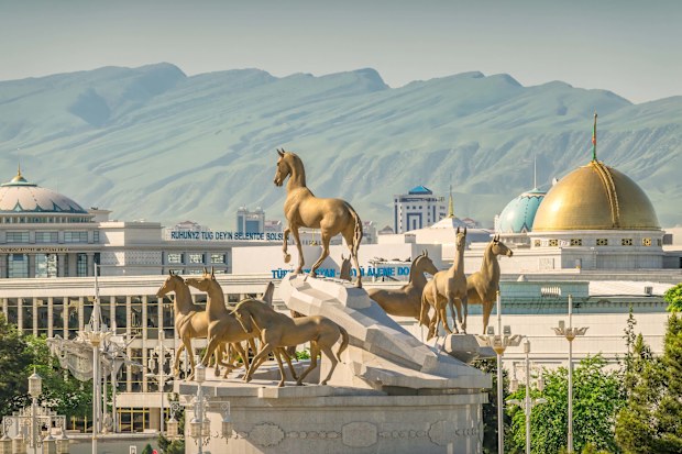 Ashgabat Turkmenistan with the monument to ten Akal Theke horses.