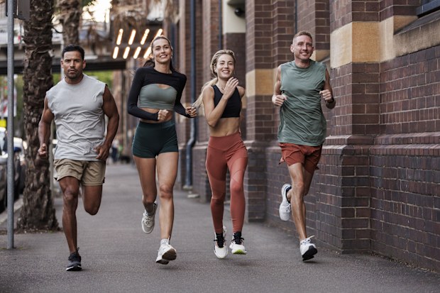 Running on the street, friends enjoying their jog together run club