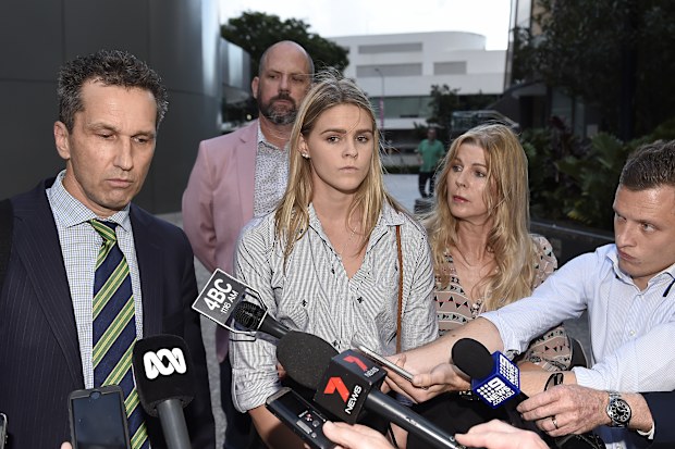 Shayna Jack, surrounded by her lawyer and family, faces media early in her hellish drugs saga.