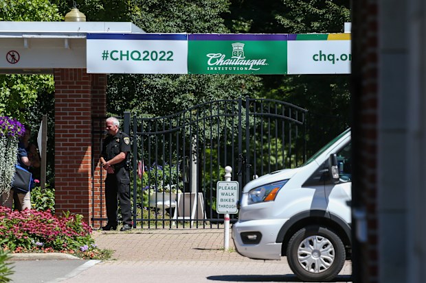 An officer stands outside a gate of the Chautauqua Institution in Chautauqua, N.Y., Friday, Aug. 12, 2022. 