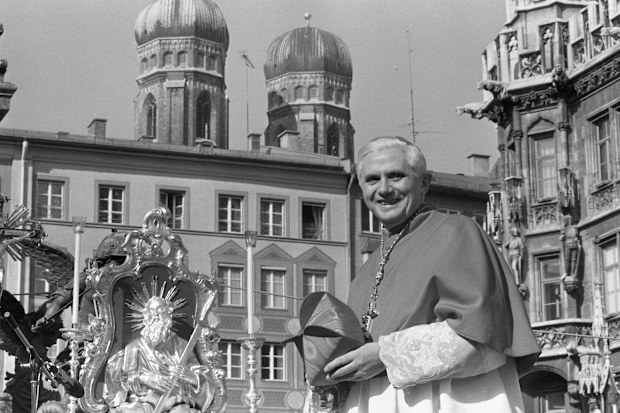 Cardinal Joseph Ratzinger, with the towers of Munich's cathedral in the background, bids farewell to Bavarian believers in downtown Munich, Germany, on February 28, 1982, before heading to Rome to lead the Congregation for the Doctrine of the Faith at the Vatican. Cardinal Ratzinger went on to become Pope Benedict XVI.