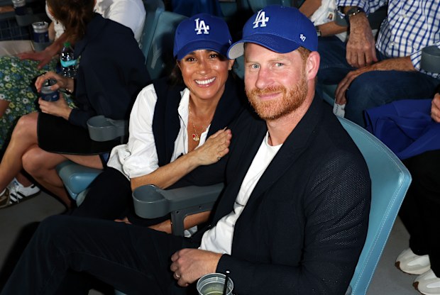Prince Harry and Meghan Markle, the Duke and Duchess of Sussex, at Game 4 of baseball's World Series between the Los Angeles Dodgers and the Toronto Blue Jays in Los Angeles, Tuesday, Oct. 28, 2025. 