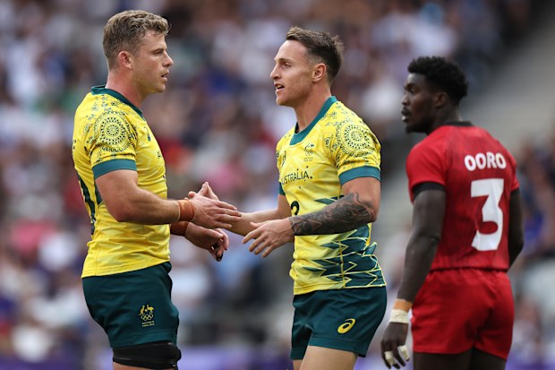 Corey Toole celebrates scoring a try with Nick Malouf during Australia's win over Kenya on day one of the Paris 2024 sevens competition.