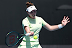 Talia Gibson of Australia plays a forehand against Zeynep Sonmez of Turkey in the Women's Singles First Round match during day two of the 2025 Australian Open at Melbourne Park on January 13, 2025 in Melbourne, Australia. (Photo by Cameron Spencer/Getty Images)