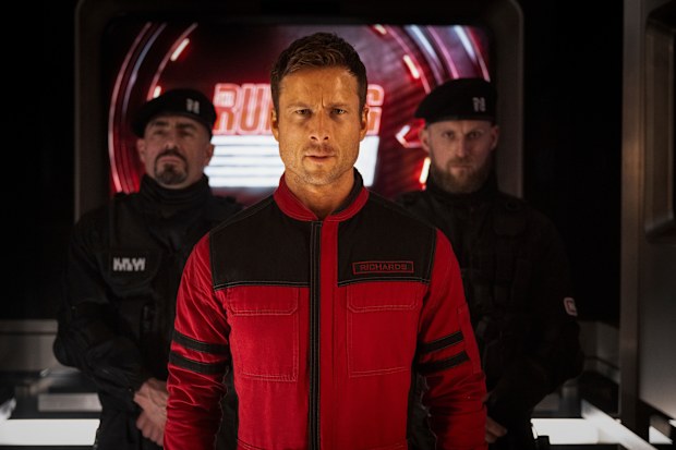 This image released by Paramount Pictures shows Glen Powell in a scene from The Running Man. 