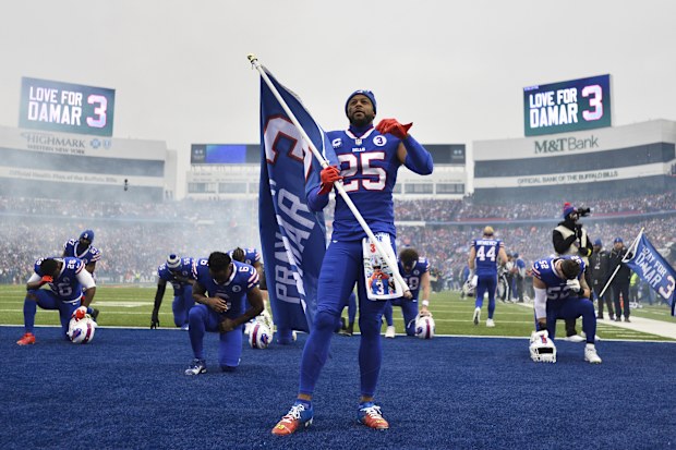 The Buffalo Bills pay tribute to Damar Hamlin before the game.