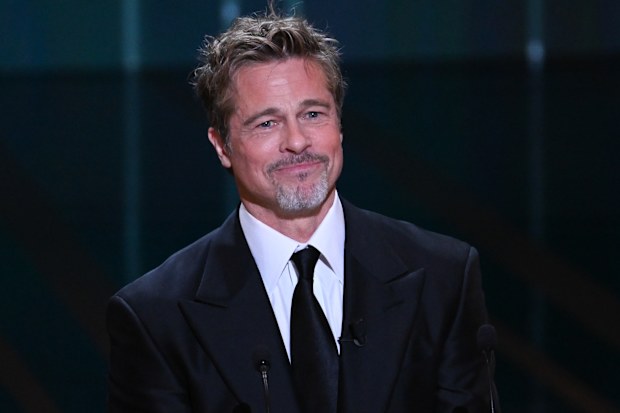 PARIS, FRANCE - FEBRUARY 24: Brad Pitt onstage while David Fincher receives the "Honorary César Award"  during the  48th Cesar Film Awards at L'Olympia on February 24, 2023 in Paris, France. (Photo by Stephane Cardinale - Corbis/Corbis via Getty Images)