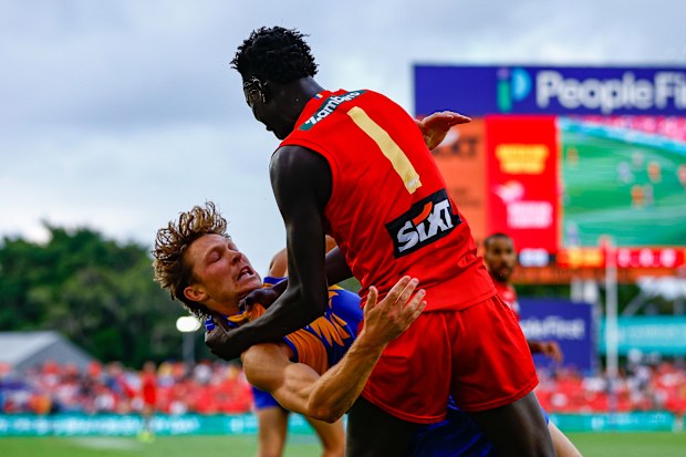 GOLD COAST, AUSTRALIA - MARCH 15: Mac Andrew of the Suns throws Milan Murdock of the Eagles to the ground during the 2026 AFL Round 01 match between the Gold Coast Suns and the West Coast Eagles at People First Stadium on March 15, 2026 in the Gold Coast, Australia. (Photo by Russell Freeman/AFL Photos via Getty Images)
