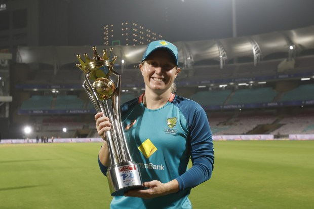Alyssa Healy of Australia poses with the series trophy after winning the T20I series against India.